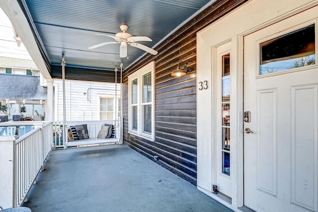 exterior space with covered porch and ceiling fan