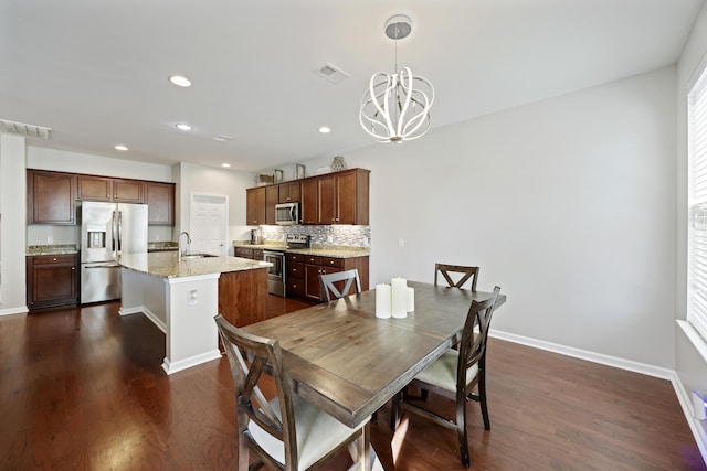 dining area featuring baseboards, visible vents, dark wood-style floors, an inviting chandelier, and recessed lighting