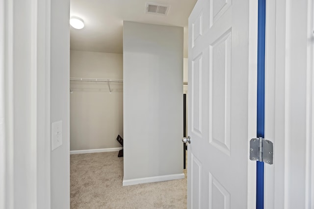 spacious closet featuring carpet and visible vents