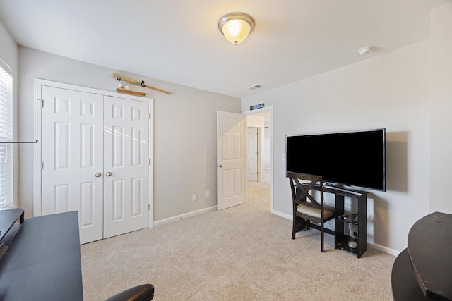 interior space featuring a closet, carpet flooring, visible vents, and baseboards