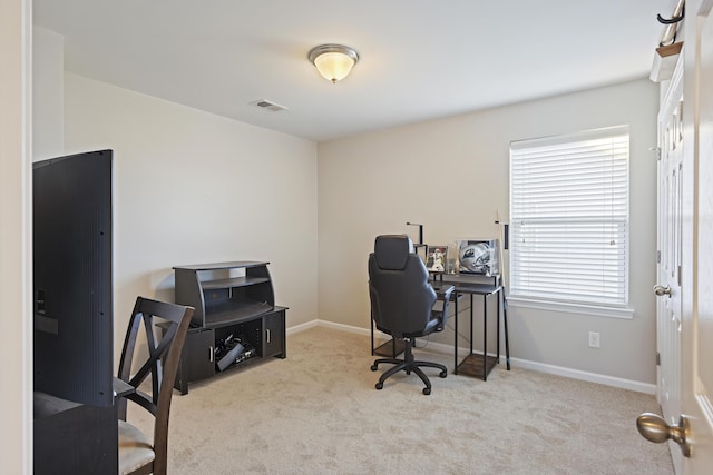 office area with carpet floors, baseboards, and visible vents