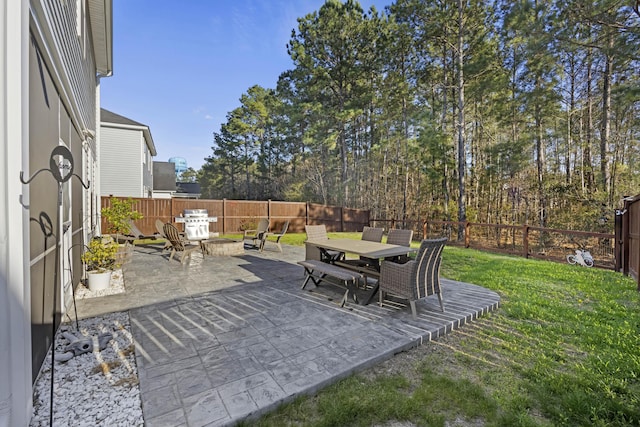 view of patio featuring a fenced backyard and outdoor dining area