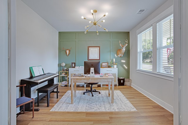 1607 Waterside Blvd, Moncks Corner, SC 29461 - office featuring a chandelier, a decorative wall, baseboards, and light wood finished floors