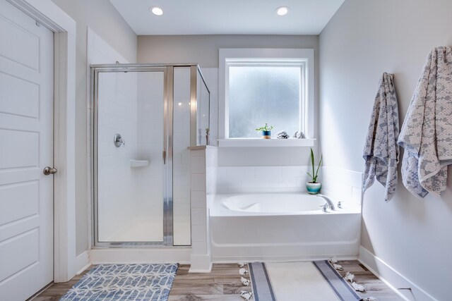 1607 Waterside Blvd, Moncks Corner, SC 29461 - bathroom with a bath, a shower stall, baseboards, wood finished floors, and recessed lighting