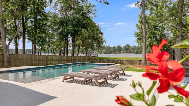 1607 Waterside Blvd, Moncks Corner, SC 29461 - view of swimming pool with a fenced backyard, a patio area, and a water view