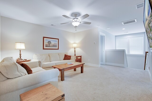 1607 Waterside Blvd, Moncks Corner, SC 29461 - living room featuring light colored carpet, a ceiling fan, and baseboards