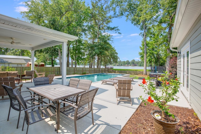1607 Waterside Blvd, Moncks Corner, SC 29461 - fenced backyard with a trampoline, a water view, a patio, and a ceiling fan