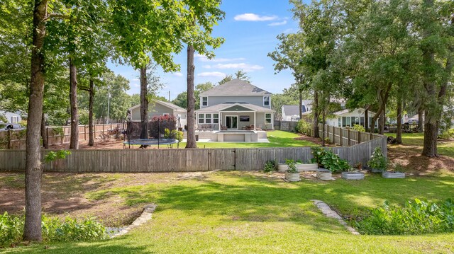 1607 Waterside Blvd, Moncks Corner, SC 29461 - view of yard featuring a trampoline and a jacuzzi