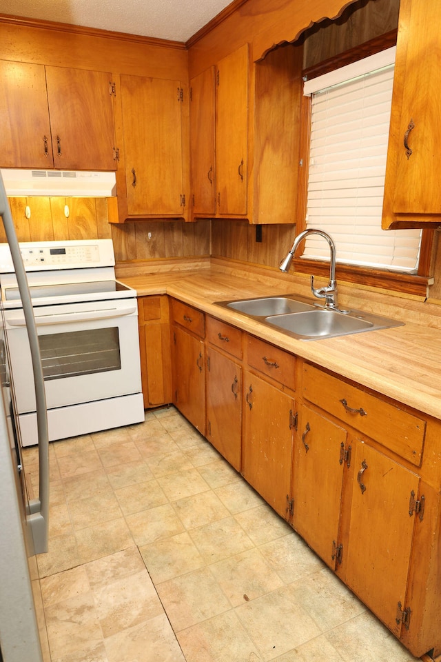 kitchen featuring a textured ceiling, sink, and white range with electric stovetop