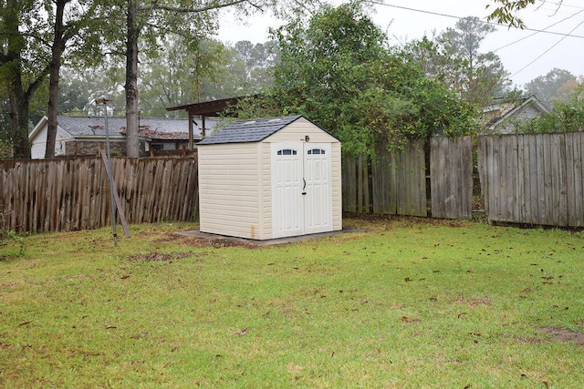 view of outbuilding featuring a lawn