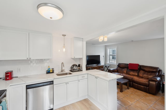 9 F St, Charleston, SC 29403 - kitchen with dishwasher, open floor plan, a peninsula, white cabinetry, and backsplash