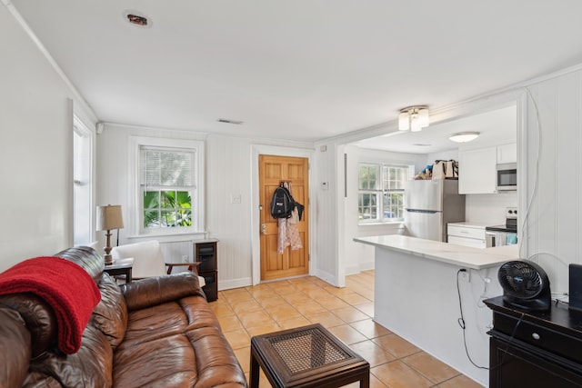 9 F St, Charleston, SC 29403 - living area featuring light tile patterned flooring and baseboards