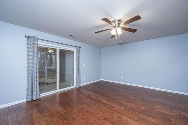 unfurnished room featuring ceiling fan and dark hardwood / wood-style flooring