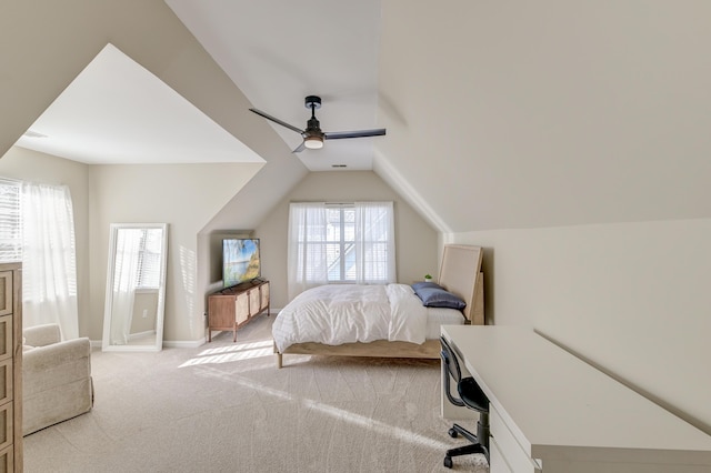 bedroom featuring ceiling fan, light carpet, and vaulted ceiling