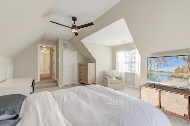 carpeted bedroom featuring ceiling fan and vaulted ceiling