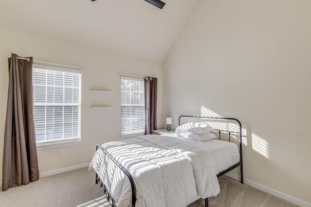 carpeted bedroom featuring high vaulted ceiling