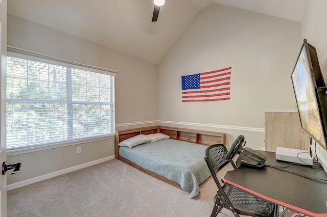 carpeted bedroom with high vaulted ceiling and ceiling fan