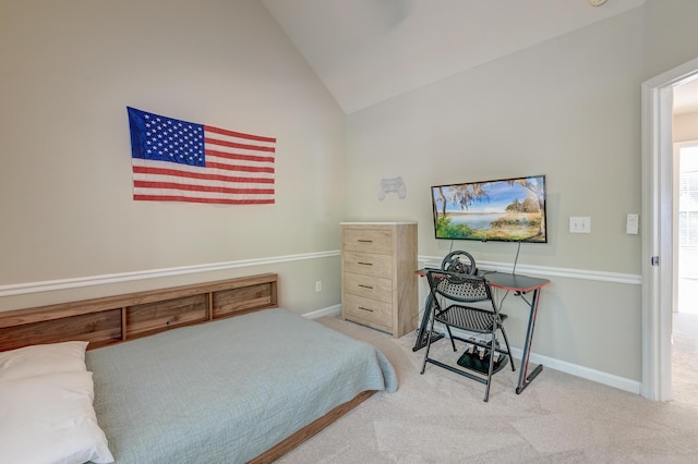 carpeted bedroom featuring high vaulted ceiling