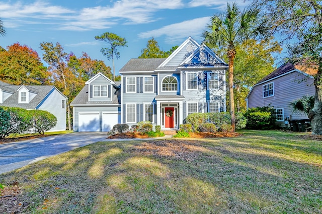 view of front of home featuring a garage and a front lawn