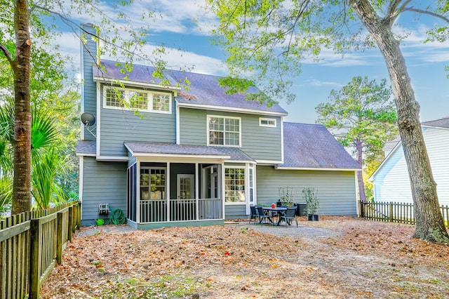 back of house with a sunroom