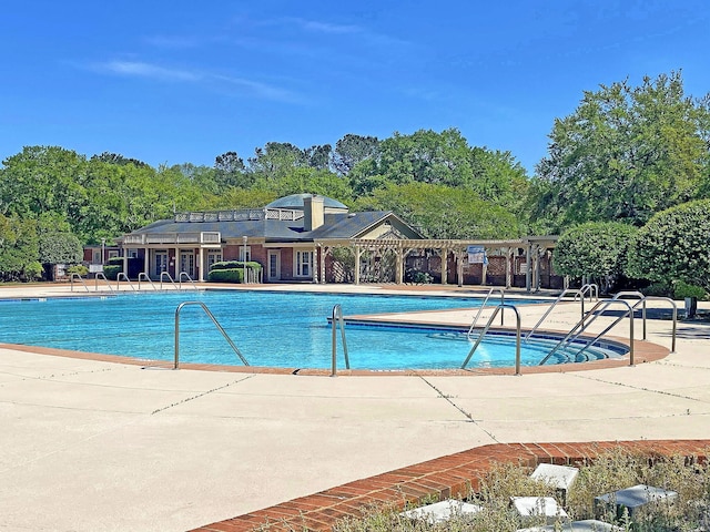 view of swimming pool with a patio