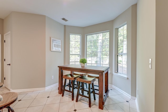 tiled dining area with a wealth of natural light