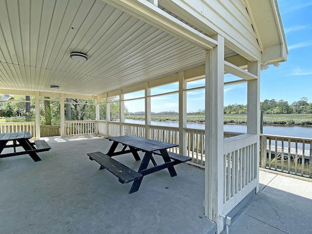 view of patio featuring a water view