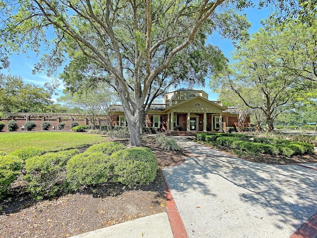 view of front of home featuring a front yard and a porch