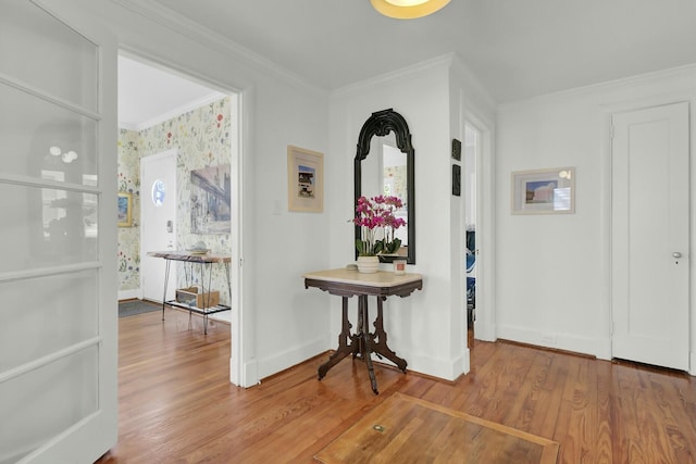 hallway featuring hardwood / wood-style flooring and crown molding