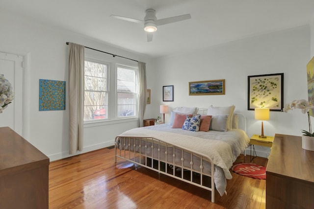 bedroom featuring hardwood / wood-style flooring and ceiling fan