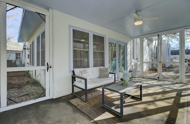 sunroom with a wealth of natural light and ceiling fan