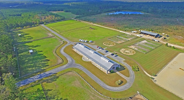 birds eye view of property featuring a rural view and a water view