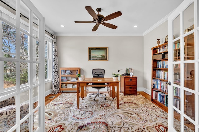 home office featuring ornamental molding, wood finished floors, and baseboards