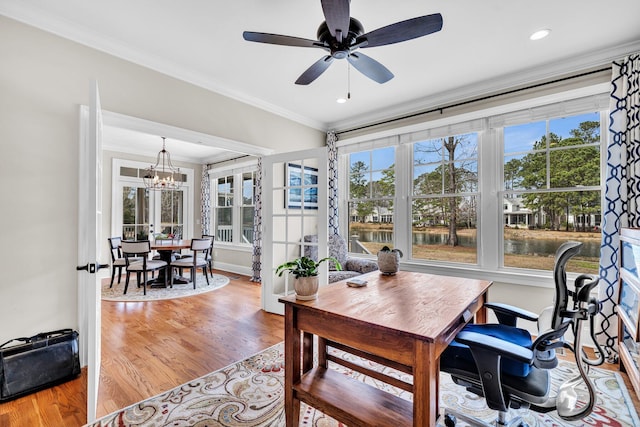 interior space with recessed lighting, ornamental molding, light wood-type flooring, baseboards, and ceiling fan with notable chandelier