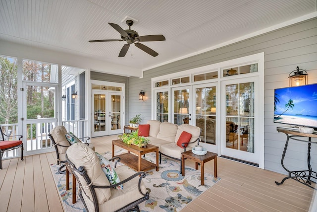 sunroom featuring french doors and ceiling fan