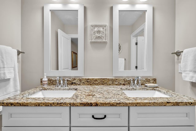 bathroom featuring double vanity and a sink