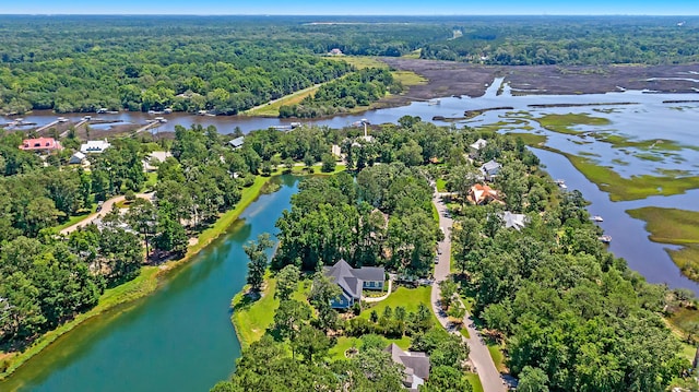 aerial view featuring a water view and a wooded view