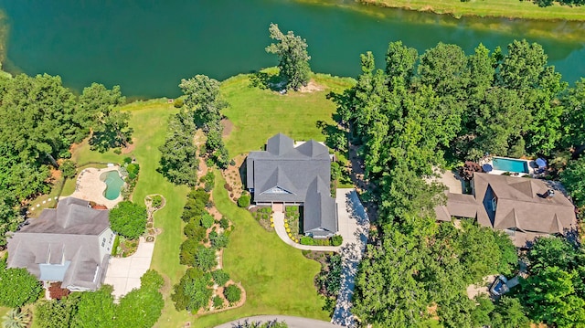 birds eye view of property with a water view