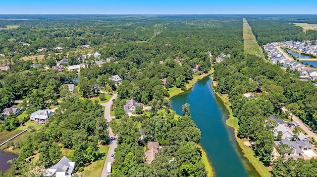 aerial view featuring a water view and a wooded view