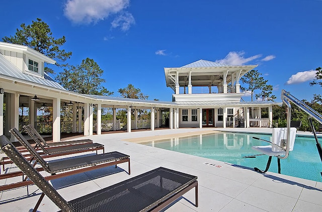 pool featuring fence and a patio