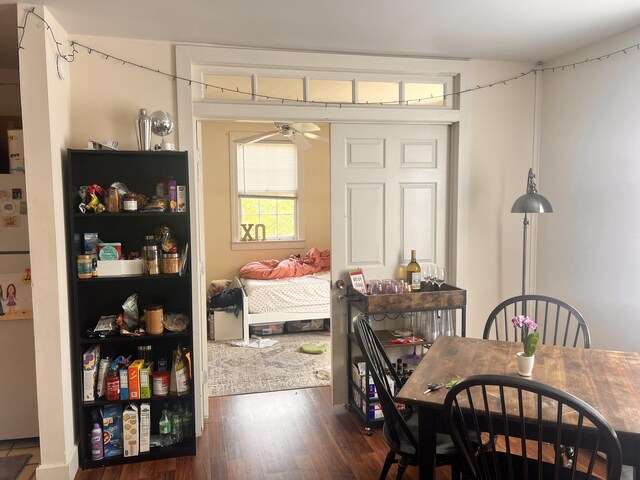 dining area featuring dark hardwood / wood-style flooring and ceiling fan