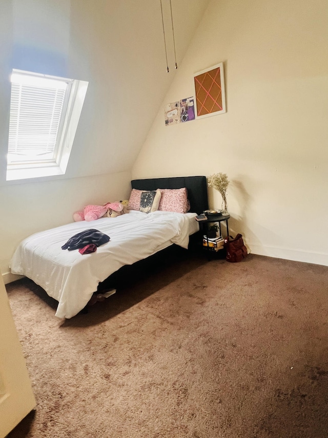 carpeted bedroom featuring lofted ceiling