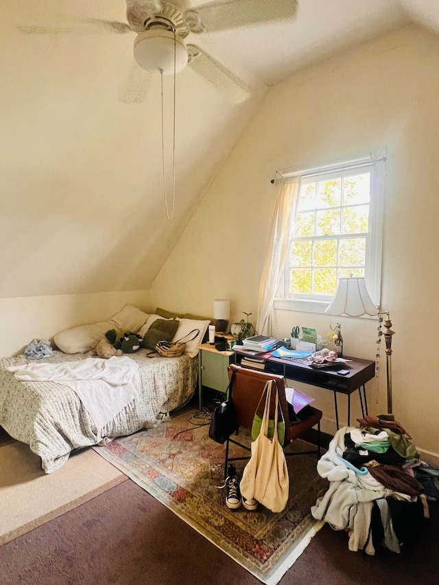 carpeted bedroom featuring ceiling fan and lofted ceiling