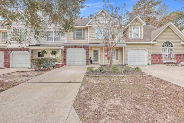 townhome / multi-family property featuring a garage