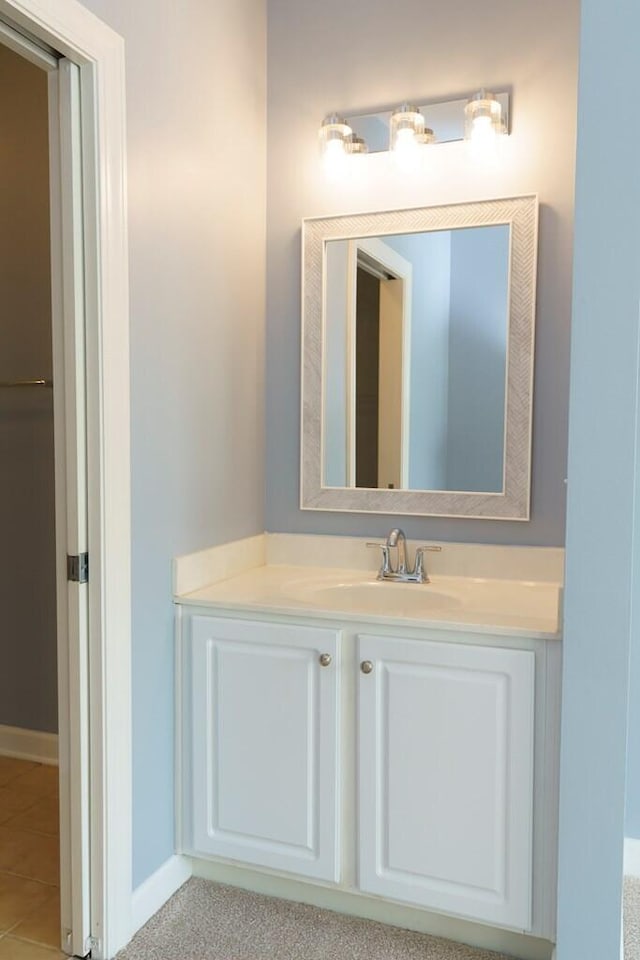 bathroom featuring baseboards and vanity
