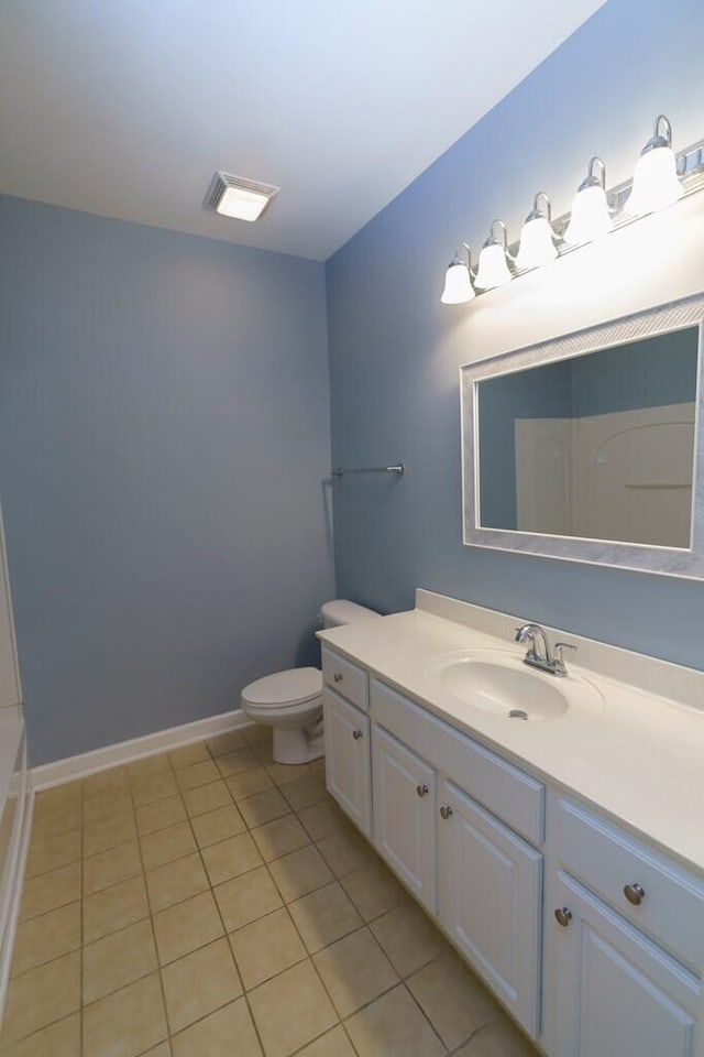 full bathroom with toilet, tile patterned floors, vanity, and baseboards