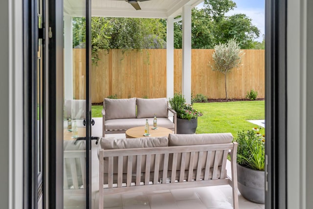 exterior space featuring ceiling fan