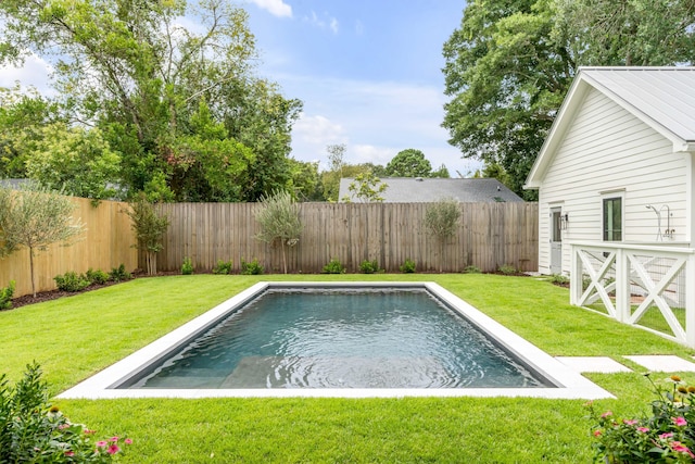 view of pool featuring a yard