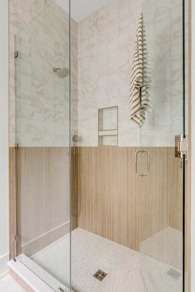 bathroom with a shower with shower door