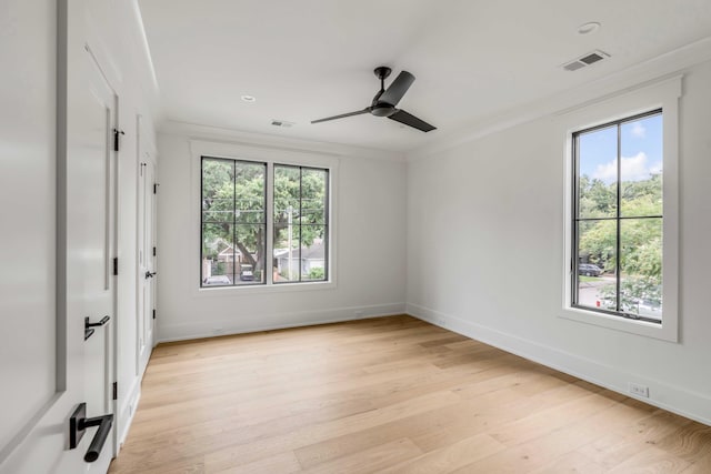 unfurnished room featuring ceiling fan, ornamental molding, and light hardwood / wood-style flooring